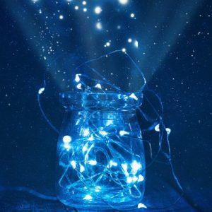 a jar filled with small luminous orbs, floating up and outwards to illuminate the darkness